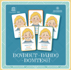 Eske med kort som har blider av ulike ansiktsuttrykk.